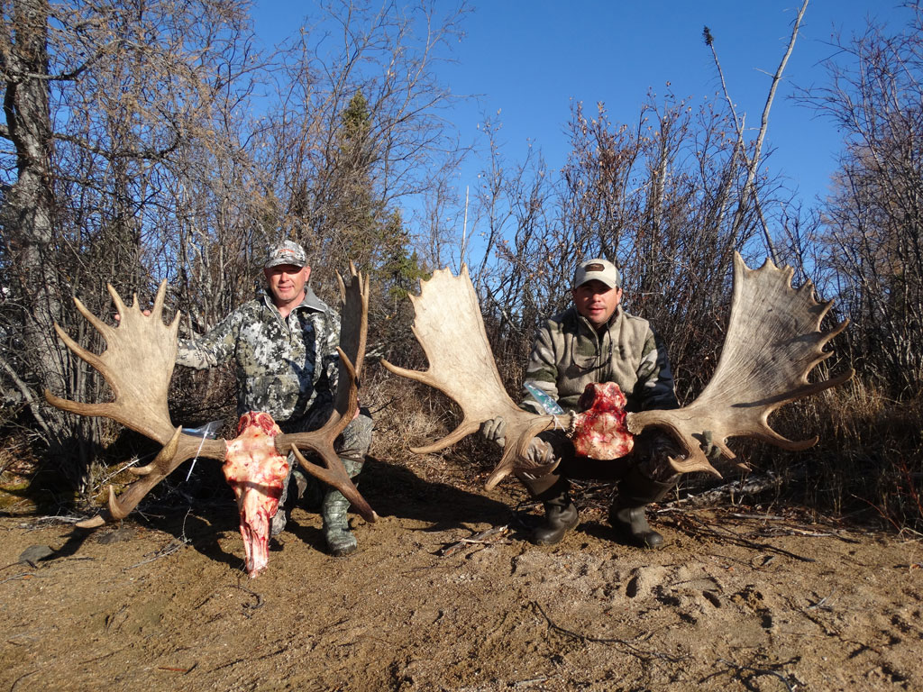 Rusty and Kelly Sims with their 40 and 58-inch trophy bull moose.