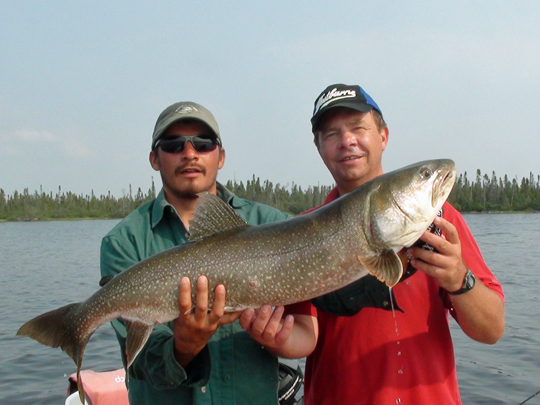 Germain Bourque (right) with trophy Lake Trout at North Knife Lake Lodge