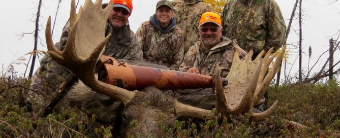 Ed Coleman, Ladonna Coleman and Ward Rabb with bull moose at Webber's Lodges.