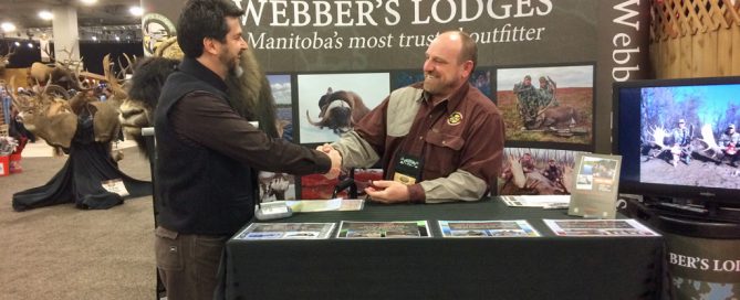 Webber's Lodges General Manager Russ Mehling (center) shakes hands and answers questions. Western Hunting & Conservation Expo. Booth 733.